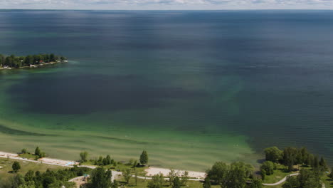 Aerial-parallax-shot-revealing-the-beautiful-coastline-of-Lake-Simcoe-in-Ontario