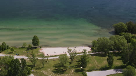 Cinematic-orbit-shot-of-Innisfil-beach-and-Lake-Simcoe-in-Ontario,-Canada