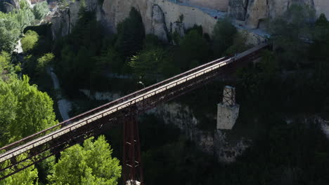 Bridge-Crossing-Valley-into-Cuenca,-Spain---Aerial
