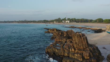 Rocky-calm-shore-of-Sri-Lanka-Salli-beach-tropical-island-at-dawn