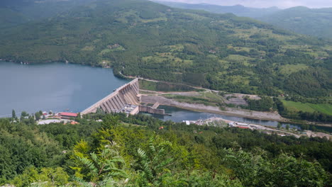 A-top-scenic-view-of-a-beautiful-hydroelectric-power-plant-in-rich-green-valley