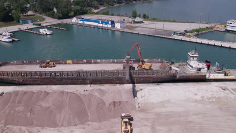 Bird's-Eye-View-Of-Loader-Crane-Offloading-Gravel-From-Sam-Laud-Container-Ship-At-Kingsville-Harbour