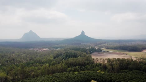 Mount-Coonowrin-And-Mount-Beerwah-On-A-Foggy-Day-At-Glass-House-Mountains-In-Sunshine-Coast-Region,-QLD,-Australia
