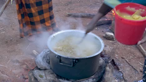 putting-local-traditional-ghee,-butter-cow-product,-milk-product-to-the-meat-stew-is-the-main-signature-of-the-Ethiopian-food-in-the-big-parties