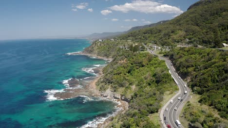 Mountain-Road-With-Cars-Traveling-At-Sea-Cliff-Bridge-On-Sunny-Day-Near-Wollongong-In-NSW,-Australia