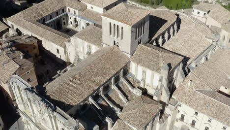 Cobblestone-and-Limestone-Ancient-Building-Rooftops-in-Cuenca,-Spain---Aerial-View