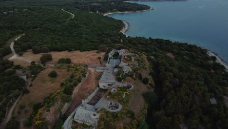Cinematic-aerial-view-drone-above-a-historic-World-War-I-fortification-seaside-fort-fortress-by-the-idyllic-Adriatic-mediterranean-sea-ocean-with-blue-water-and-hidden-beaches-for-travel-in-summer