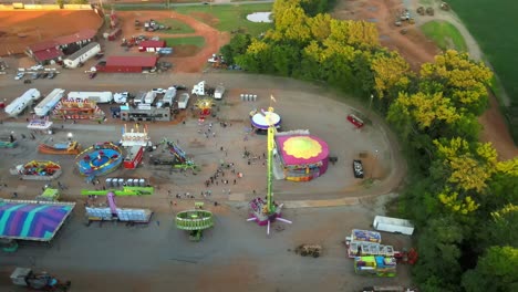 Aerial-orbit-of-a-small-town-carnival-and-it's-attractions