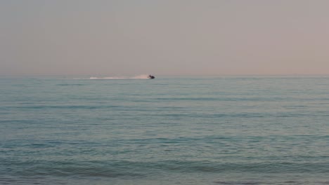 Ocean-waves-with-jetski-passing-by-on-the-background