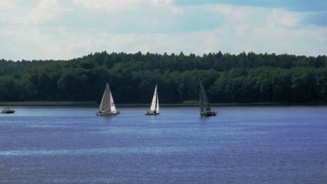 Tourist-Sailing-On-Yachts-On-Calm-Lake-Of-Charzykowy-In-Northern-Poland