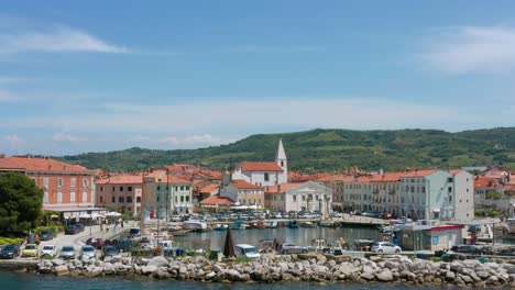 Waterfront-Buildings-And-Marina-From-Adriatic-Sea-At-Daytime-In-Istria,-Slovenia
