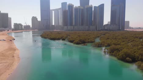 Aerial-rising-from-Al-Reem-Island-mangroves-with-unrecognizable-people-kayaking