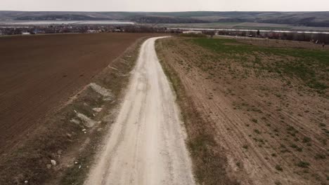 Aerial-View-Following-Dirt​-Road