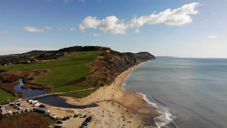 Aerial-View-Of-Charmouth-Beach-Towards-Cliffs-In-Dorset