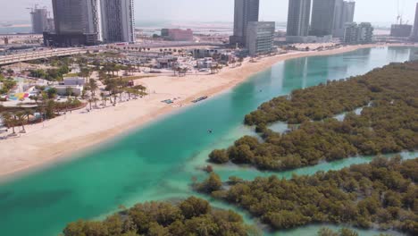 Aerial-circling-shot-of-Al-Reem-recreational-space-and-mangroves-on-sunny-day