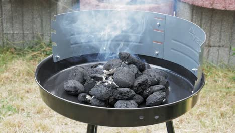 Macro-Of-Smoke-Coming-Out-From-The-Burning-Charcoal-Into-Circular-Grill