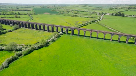 Aerial-View-Of-Welland-Viaduct-With-Green-Pasture-And-Field-In-England,-UK
