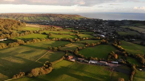 Aerial-view-of-countryside-fields-and-farmland-on-the-coast-of-Devon-in-England