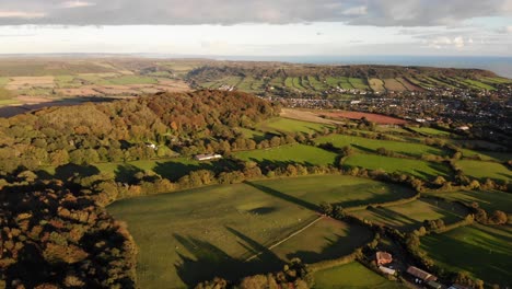 Aerial-Pan-Left-Above-Countryside-Fields-Near-Fire-Beacon-Hill-In-Devon