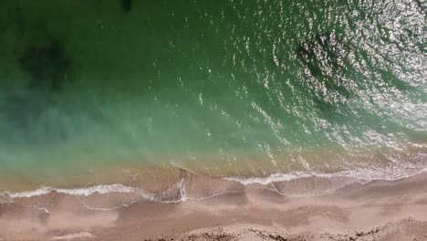 Top-View-Of-Turquoise-Water-And-Sandy-Beach