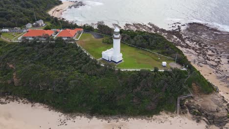 Aerial-View-Of-Norah-Head-Lighthouse-With-Nimbin-Beach---Norah-Head,-Headland-In-Central-Coast,-New-South-Wales,-Australia