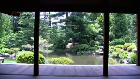 View-of-koi-pond,-garden-and-engawa-from-interior-of-Japanese-house