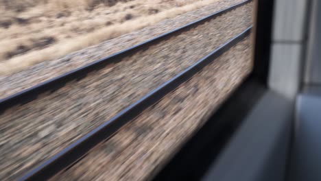 Railroad-tracks-in-motion-from-window-of-moving-train