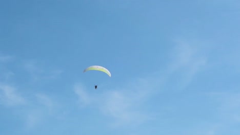 Paraglider-approaching-over-a-blue-sky