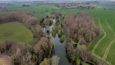 Aerial-view-of-ponds-with-a-lot-of-nature-and-fields