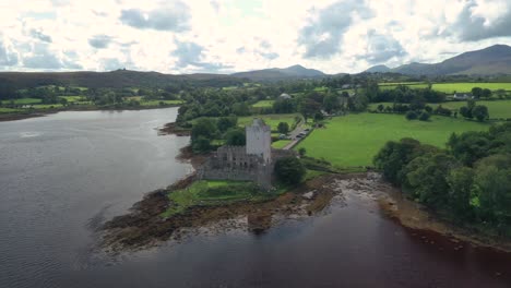 Doe-Castle,-towerhouse-and-stronghold,-15th-century-landmark-of-Ireland-on-coast-of-Sheephaven-Bay,-drone-aerial-view