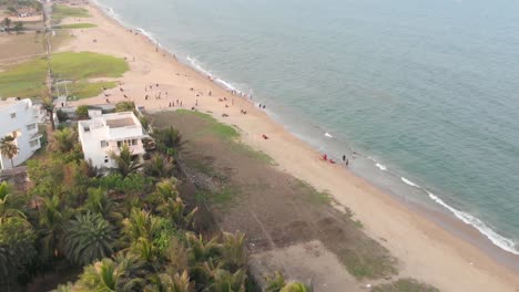 Resorts-around-ECR-beach-with-swimming-pools,-trees-and-people-walking