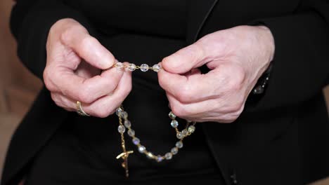 Christian-old-woman-prays-with-rosary