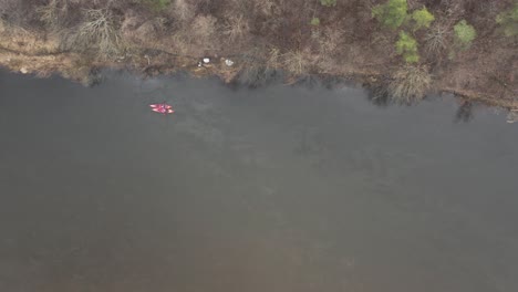 AERIAL:-Two-Canoes-Swimming-in-Early-Spring-on-a-River