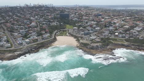 Aerial-View-Of-Tamarama-Beach-And-Blue-Sea-With-Waves---Buildings-At-Bondi,-Tamarama,-And-Bronte-At-Eastern-Suburbs-Of-Sydney,-NSW,-Australia