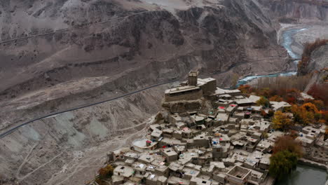 Circling-above-ancient-Altit-fort,-November-in-Hunza-Valley,-Pakistan