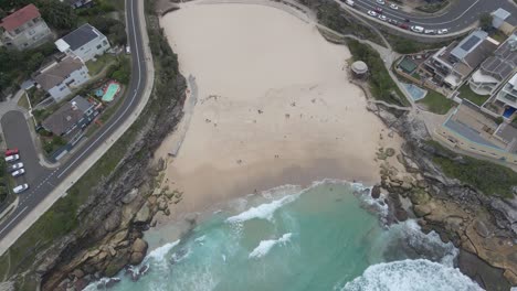 Top-down-View-Of-Tamarama-Beach-With-Coastal-Road-In-Eastern-Suburbs,-Sydney,-New-South-Wales,-Australia