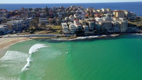 View-Of-Coastal-Suburbs-In-North-Bondi-Beach-With-People-On-Blue-Ocean-Near-Ben-Buckler-City,-Sydney,-New-South-Wales,-Australia