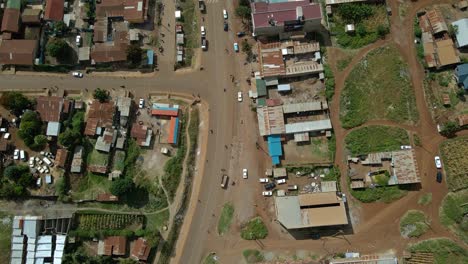 Aerial-view-above-people-and-cars-on-the-streets-of-the-Oloitokitok-town,-in-Kenya---overhead,-drone-shot
