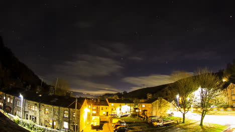 night-time-timelapse-of-the-stars-off-an-english-roof-with-traffic-streaks