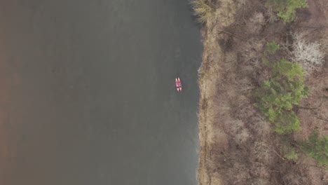 AERIAL:-Kayakers-Swimming-Close-to-Each-Other-on-a-River-in-Early-Spring-Time