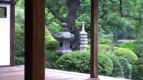 A-stone-lantern-and-pagoda-in-a-Japanese-garden-as-seen-from-an-engawa-
