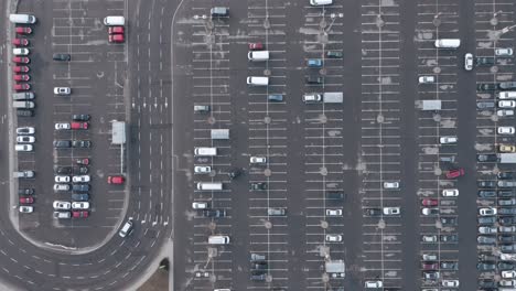 AERIAL:-Traffic-near-Half-Empty-Parking-Lot