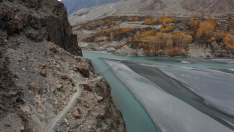 Mountain-trail-leading-to-Hussaini-Suspension-Bridge-over-Hunza-River,-Pakistan