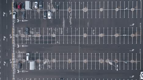 AERIAL:-Empty-Parking-Lot-with-Only-a-Few-Automobiles-Parked