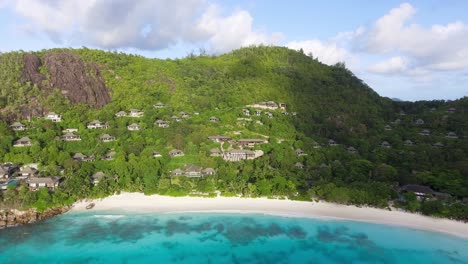 Aerial-view-of-the-beautiful-mountains-and-paradisiacal-beaches-of-Anse-la-Liberte,-Mahe,-Seychelles