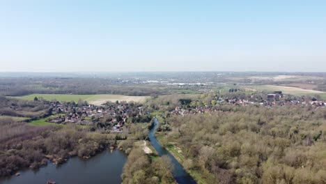 Drone-flies-above-the-River-Great-Stour-towards-the-small-village-Fordwich,-England