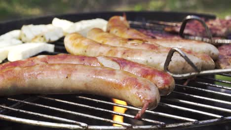 Close-Up-of-German-Sausages-Called-Bratwurst-on-Grill-with-Flames