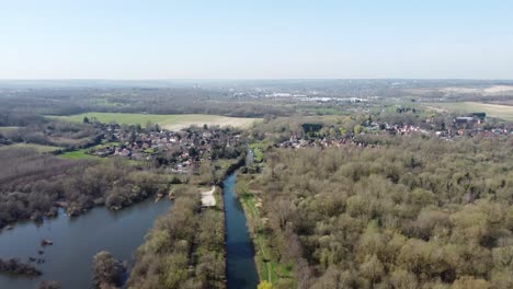 Drone-flies-high-and-fast-above-the-River-Great-Stour-towards-the-small-village-Fordwich,-England