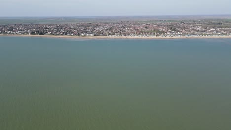 West-Mersea-Essex-Town-and-Beach-high-POV-UK-Aerial-footage-4K