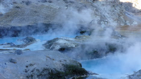 Famous-Steaming-Hot-Spring,-Hot-Creek-Geological-Site,-Travel-Destination,-Aerial-Flyover
